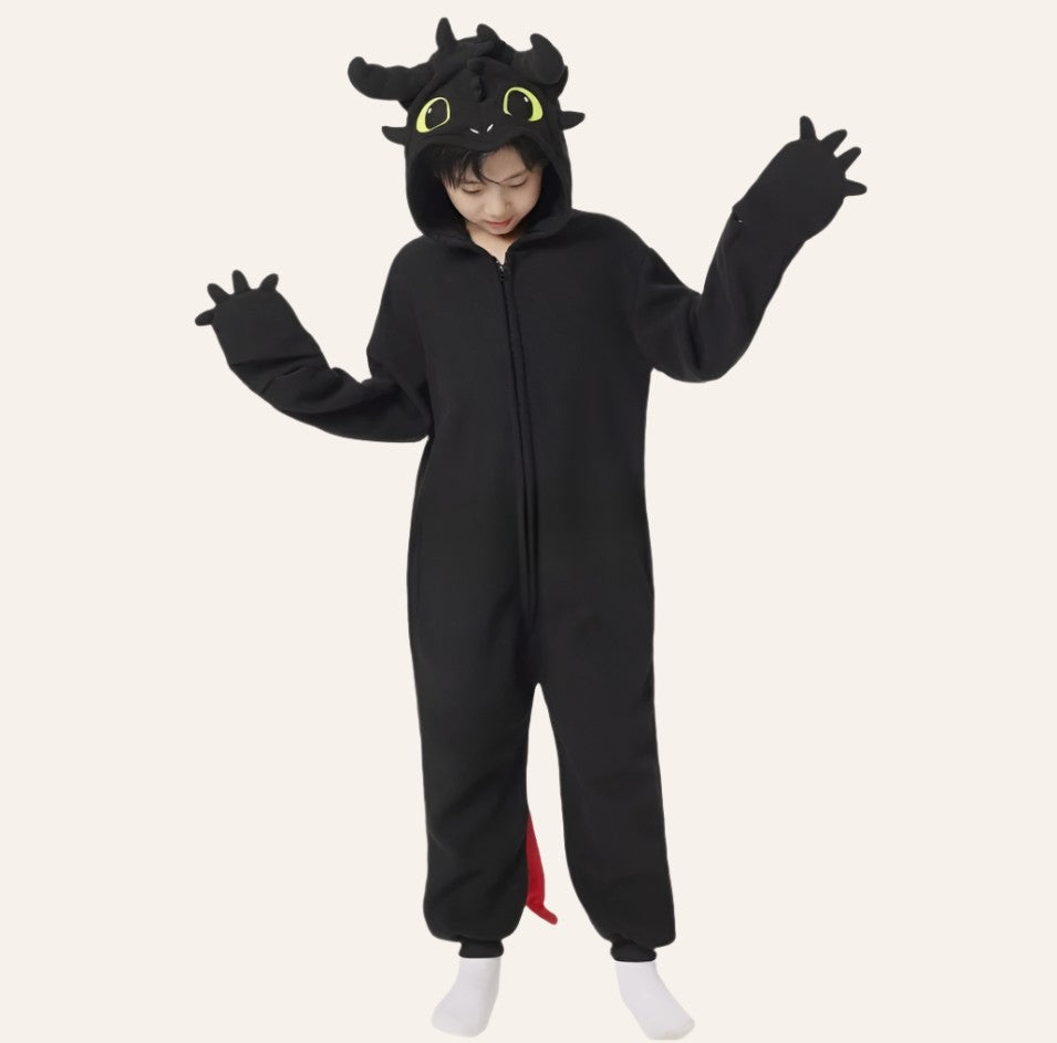 Kid wearing the Mini Comfy Dragon onesie